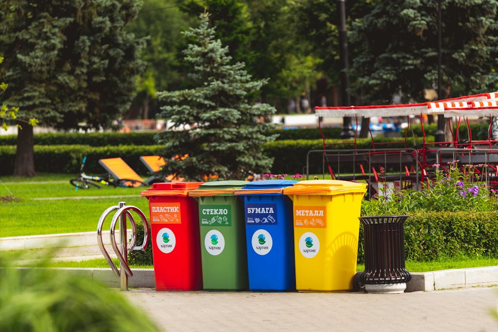 Colorful recycling bins for waste segregation in a Moscow park.